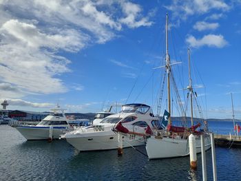 Boats moored at harbor