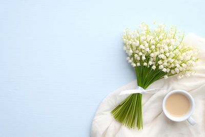 White flower vase on table