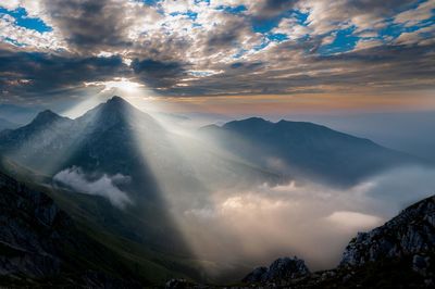 Scenic view of mountains against sky during sunset