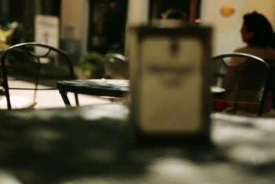 Rear view of woman sitting in restaurant