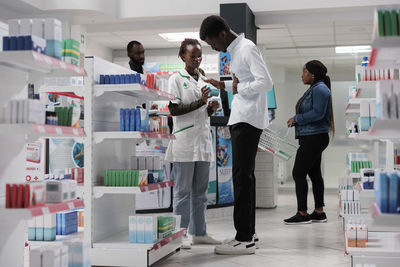 Side view of female doctor examining x-ray