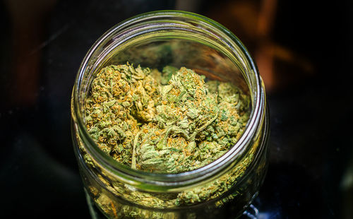 Close-up of glass jar on table