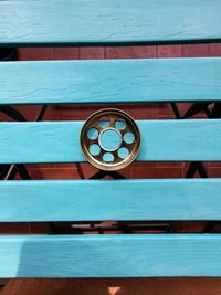 Detail shot of wooden bench against wall