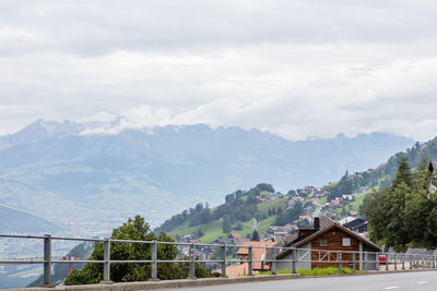 Scenic view of mountains against cloudy sky