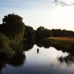 High angle view of man canoeing against sky