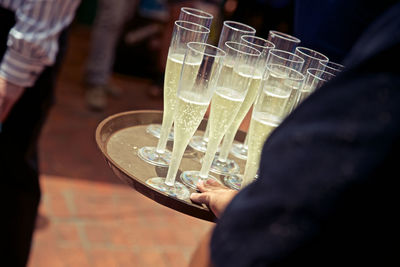 Close-up of man holding drinks