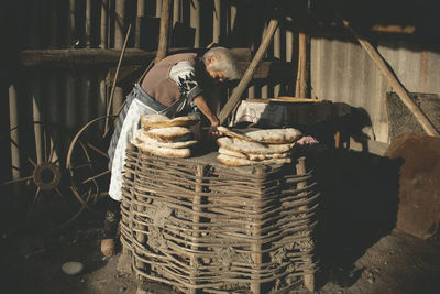 Stack of man sitting in basket