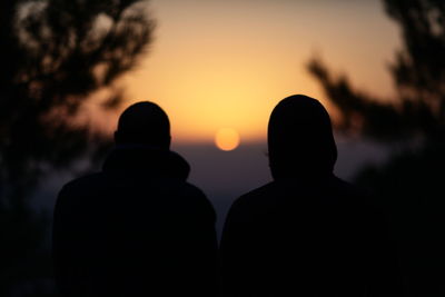 Silhouette people at sunset