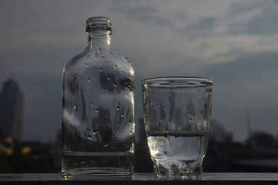 Close-up of glass bottle on table