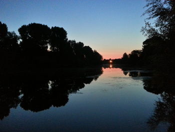 Reflection of trees in calm lake