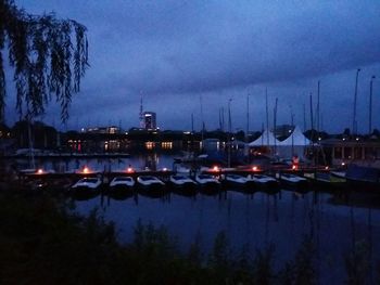 Boats moored at harbor