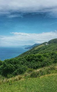 Scenic view of sea against cloudy sky