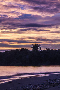 Scenic view of silhouette trees against sky during sunset