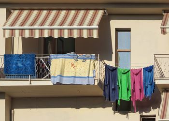 Clothes drying on clothesline outside building