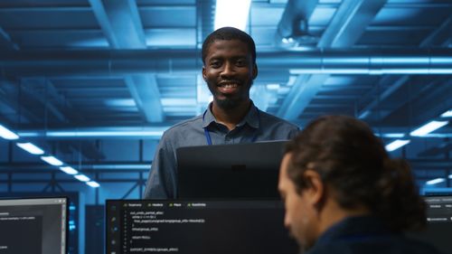 Young man using laptop at office