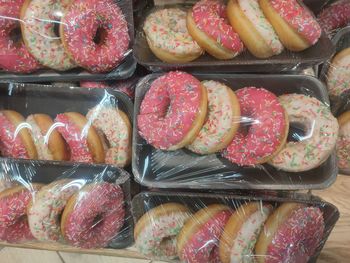 Donuts with multicolored sprinkles packaged in a single package