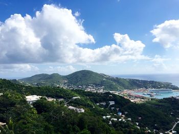 Scenic view of mountains against cloudy sky