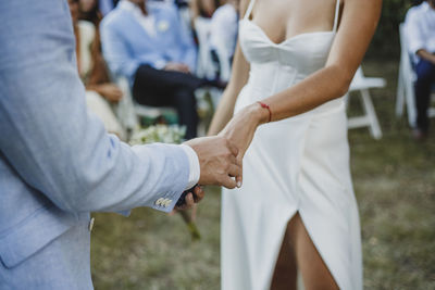 Midsection of couple in their wedding ceremony