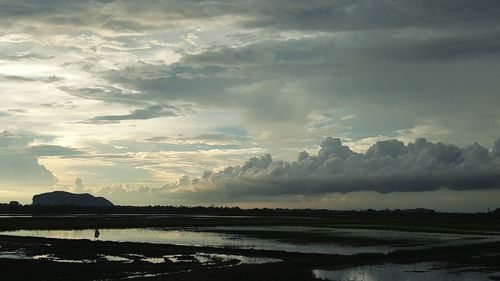 Scenic view of lake against sky during sunset