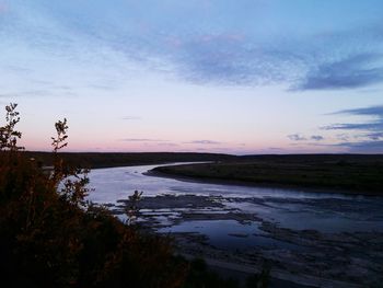 Scenic view of sea at dusk