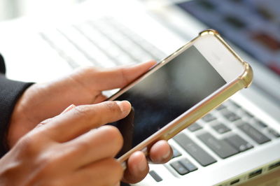 Close-up of person using mobile phone