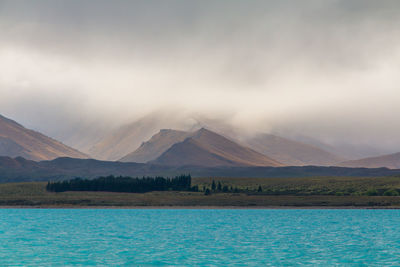 Scenic view of lake by mountains