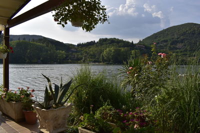 Scenic view of lake and mountains against sky