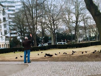 People on sidewalk in city