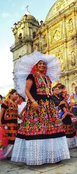 Portrait of woman in traditional clothing against sky