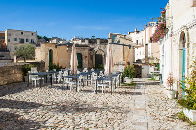 Buildings in town against blue sky