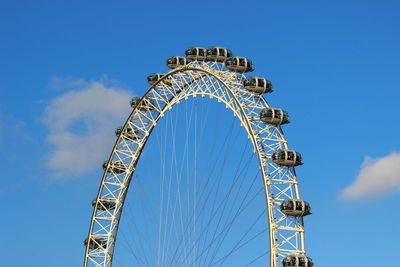 Low angle view of ferris wheel against sky