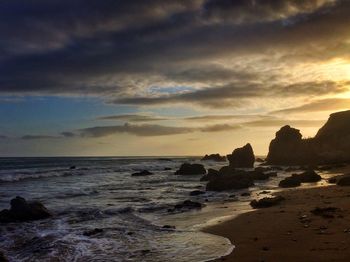 Scenic view of sea against cloudy sky