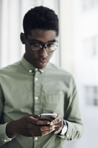 Young man using mobile phone