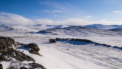 Scenic view of snow covered mountains