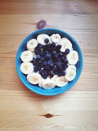 High angle view of banana with blueberries on table