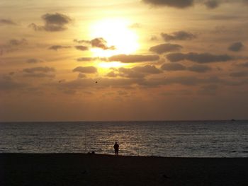 Scenic view of sea at sunset