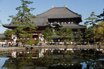 Todaiji temple and trees reflecting in pond