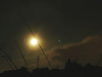 Low angle view of silhouette trees against sky during sunset