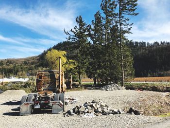 View of construction site by road against sky