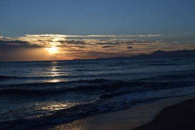 Scenic view of beach at sunset