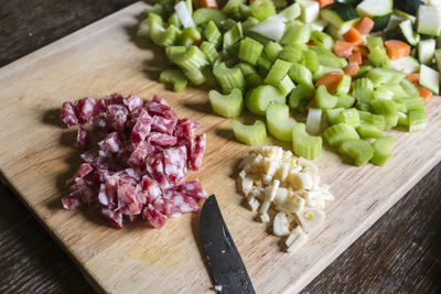 High angle view of chopped vegetables on cutting board