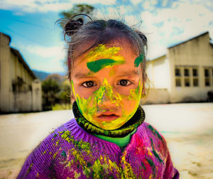 Portrait of girl covered with powder paint