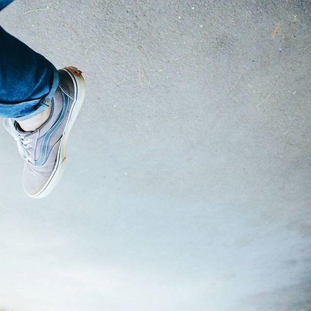 low section, person, lifestyles, shoe, standing, leisure activity, men, high angle view, human foot, footwear, unrecognizable person, part of, personal perspective, street, directly above, reflection