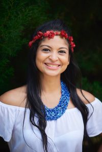 Portrait of smiling woman wearing jewelries