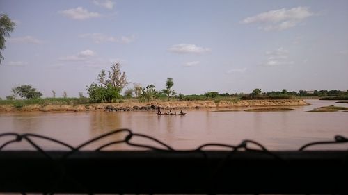 Scenic view of river against sky