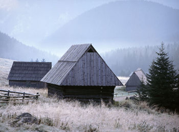 Built structure on landscape against sky