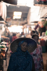 Woman wearing traditional clothes in market