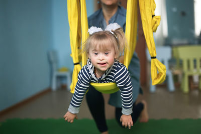 Portrait of boy playing with toys