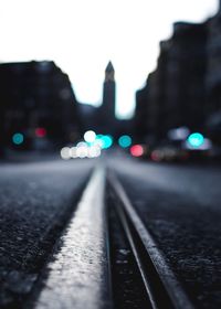 Close-up of illuminated railroad track at night