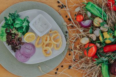 High angle view of vegetables in plate on table